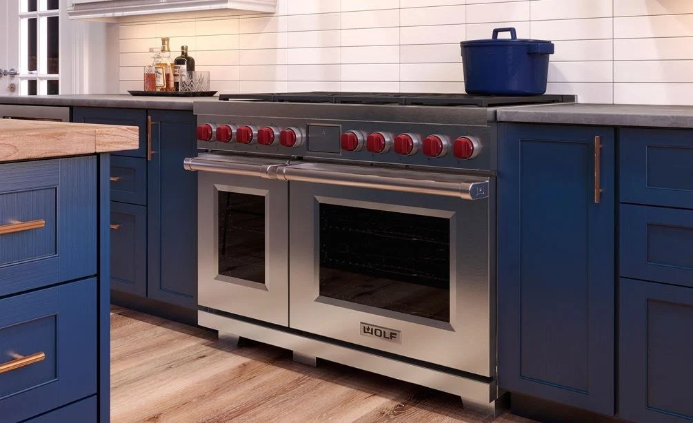 Wolf luxury stainless steel range with signature red knobs